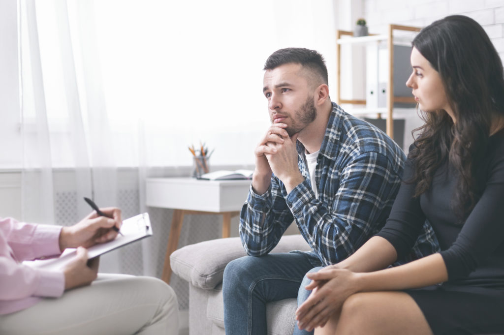 Couple listens to a counseler